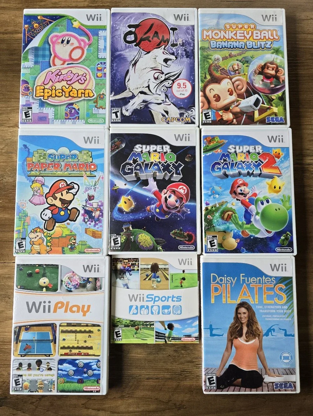 Lot of Nintendo Wii Console + 2 Remotes Nunchucks Tennis Rackets + 9 Video Games